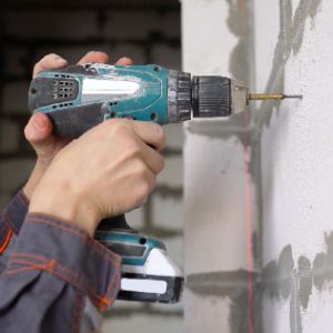 Pre-drilling cinderblock for an anchor