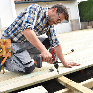 A man building a deck