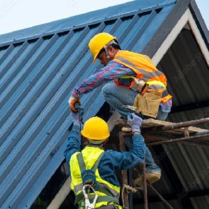 Two men drilling into a blue metal roof
